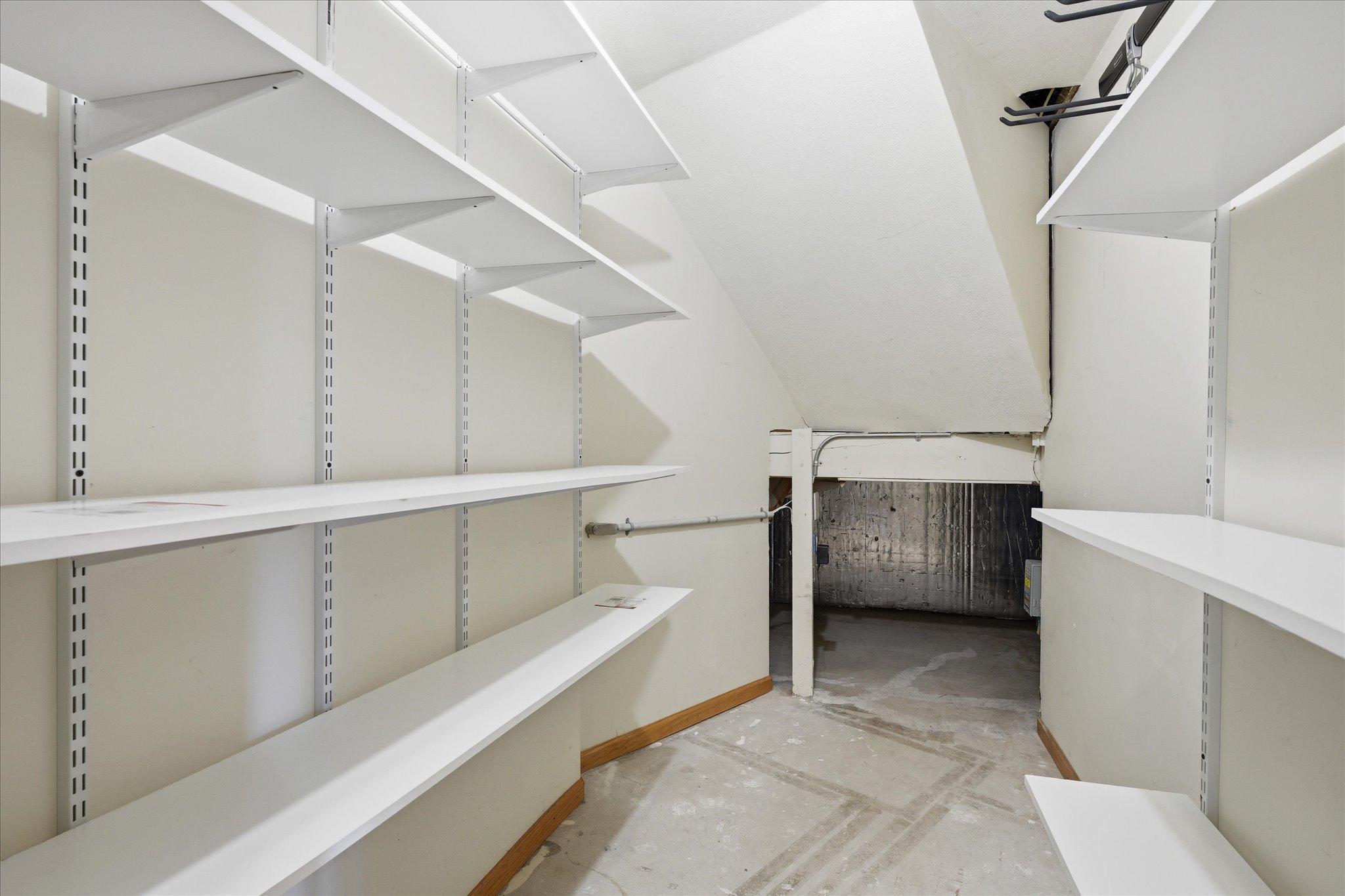 Storage galore in this home including this space under the stairs