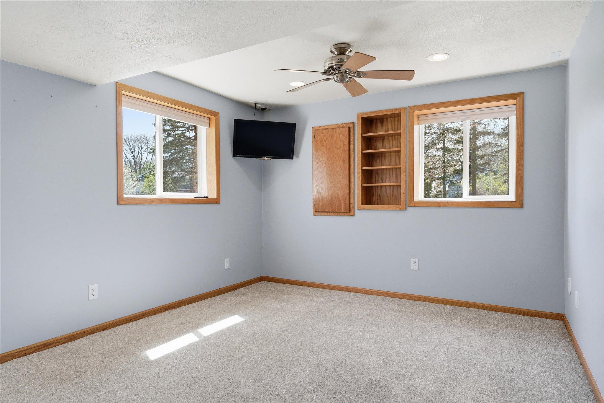 Another view of the large lower level bedroom which has brand new carpet.