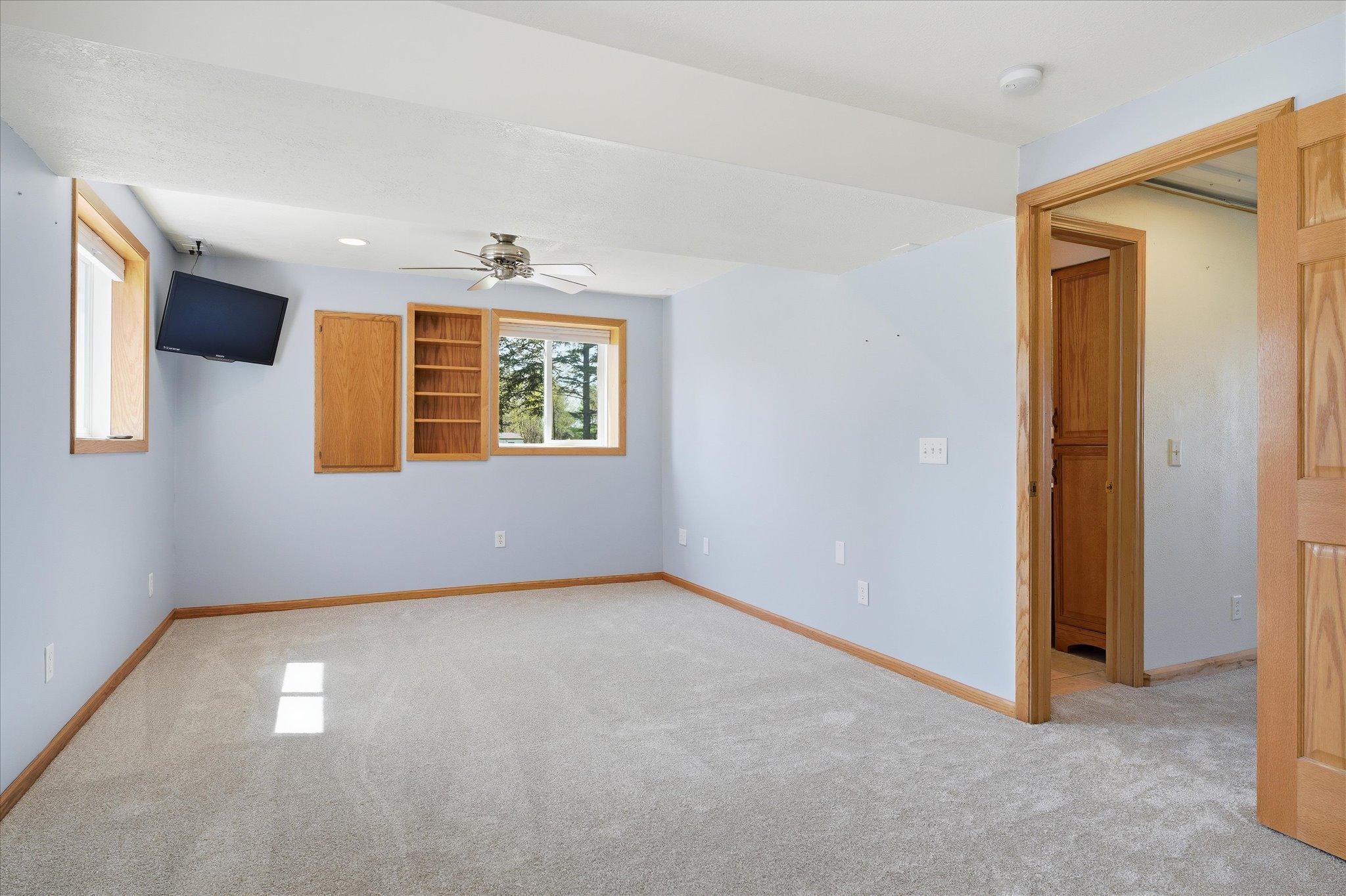 The larger bedroom in the lower level has been used as the primary bedroom. The entire lower level has brand new carpet.