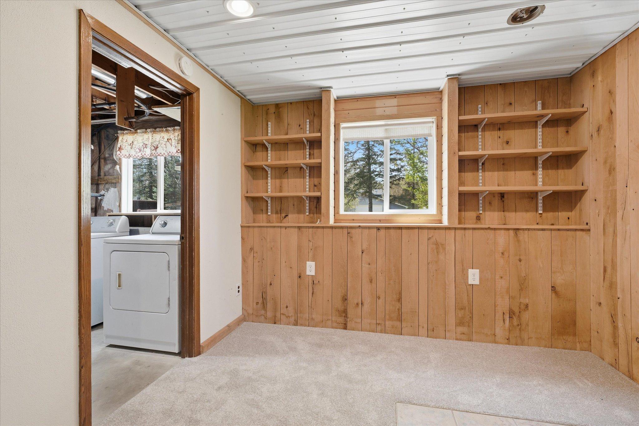 Another view of the extra space in the family room area which flows into the laundry and mechanical room.