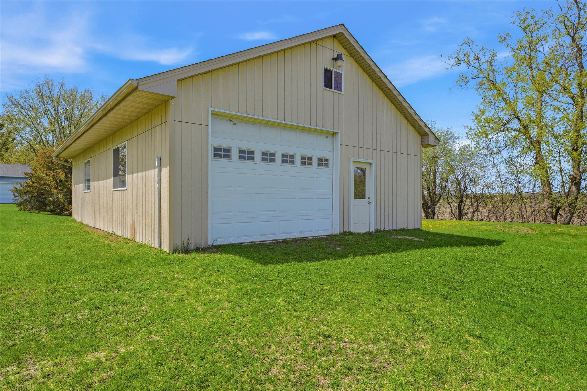 The 28 x 40 outbuilding has a concrete floor, overhead door, service door and 100 amp service.
