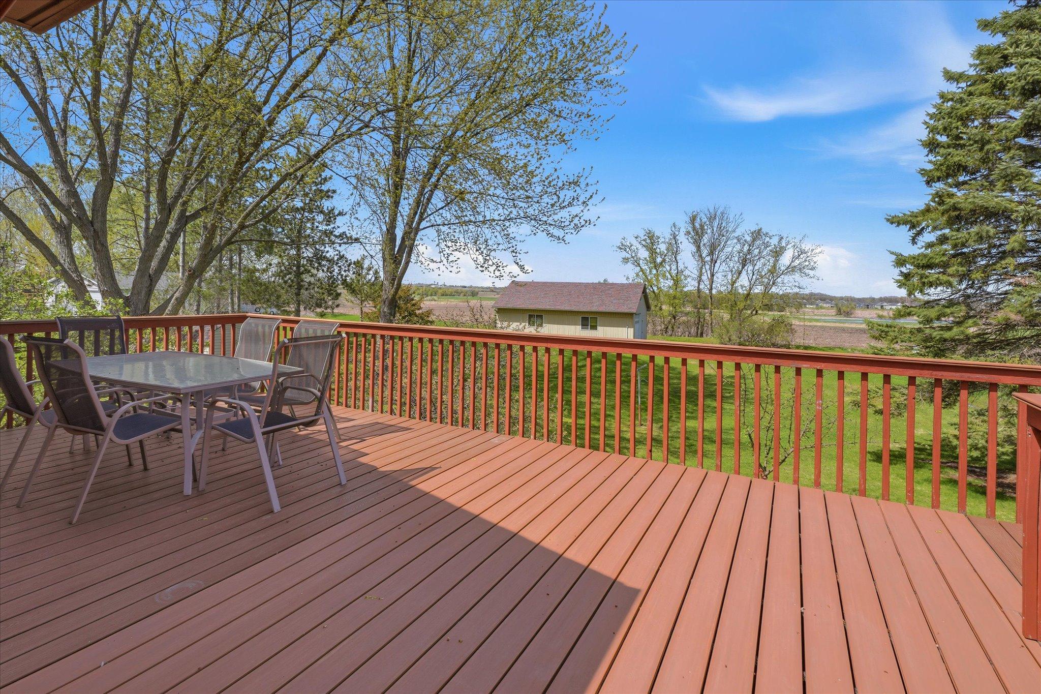 View off the deck to the huge backyard. Notice the wide open space in the back of the property.