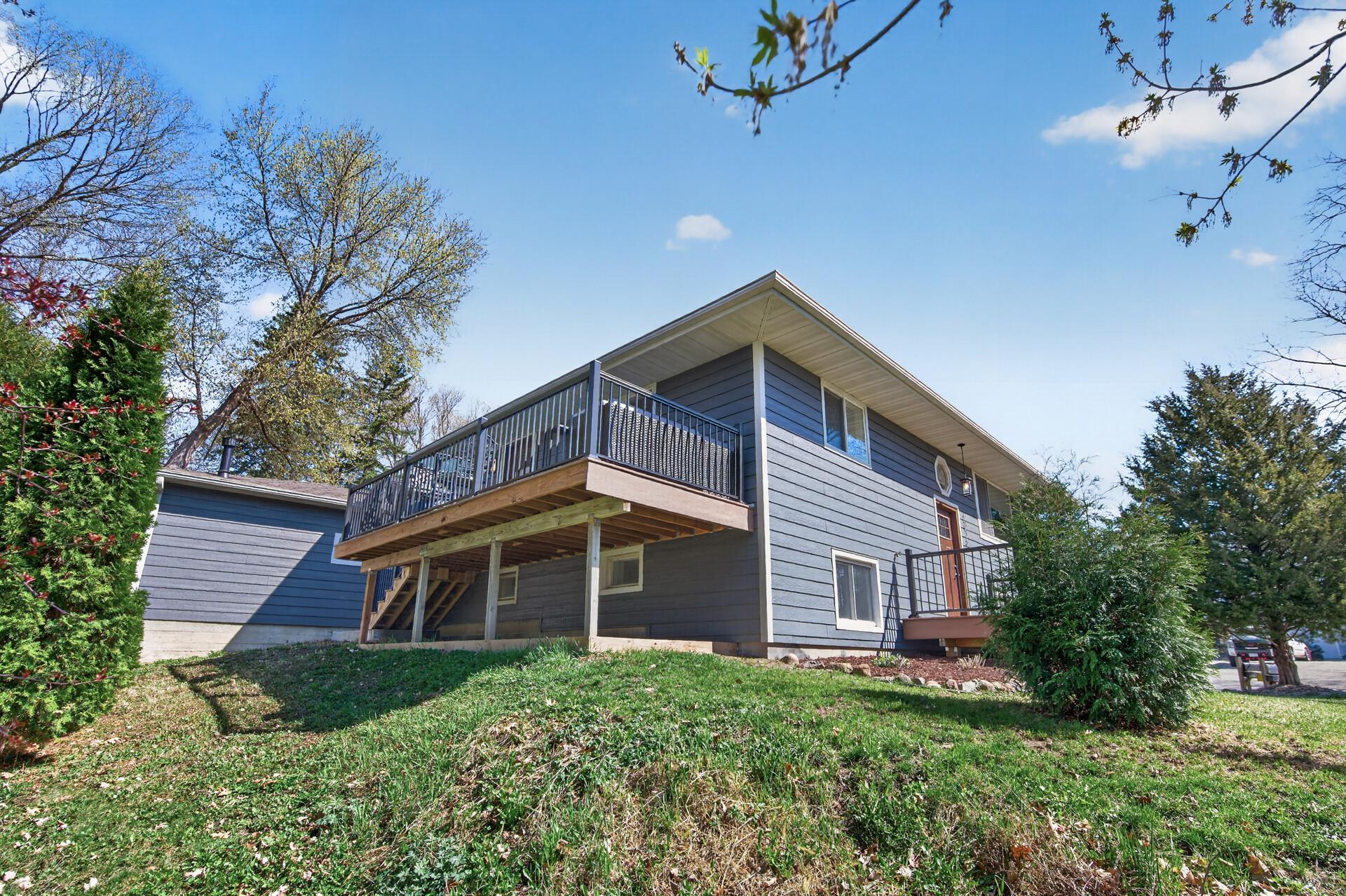 Two beautifully redone composite decks with modern metal railings.