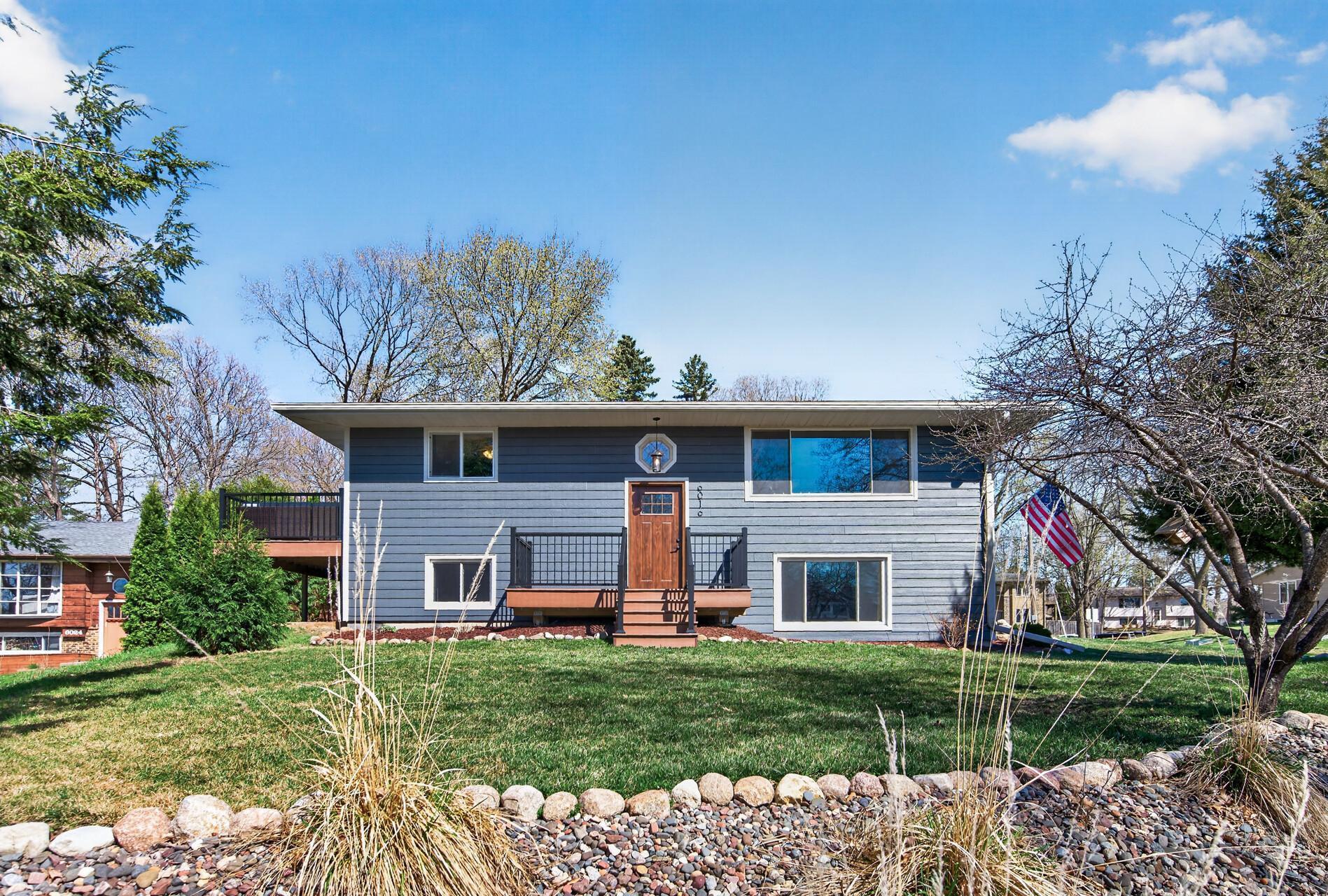 This home offers standout curb appeal with fresh, updated landscaping!