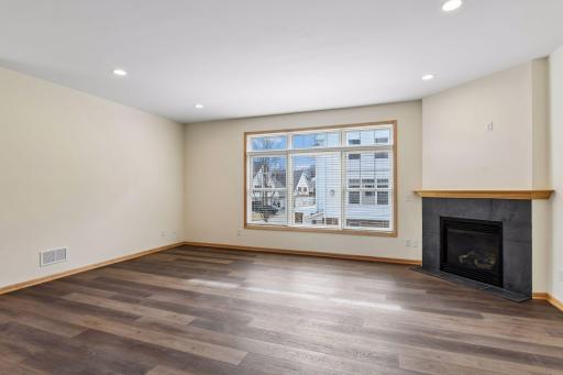 Inviting living room anchored by a cozy gas fireplace.