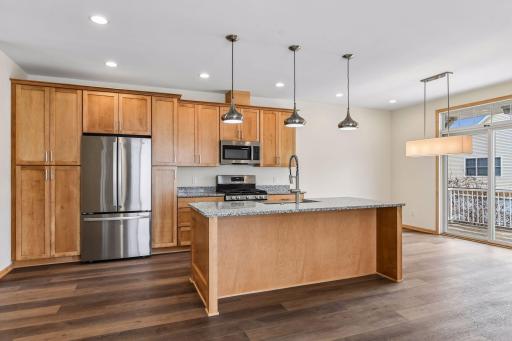 Sun-filled end unit is completely remodeled from top to bottom! Center island adds additional seating and storage.