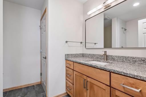 3/4 primary bathroom has a large linen/storage closet and is all new!