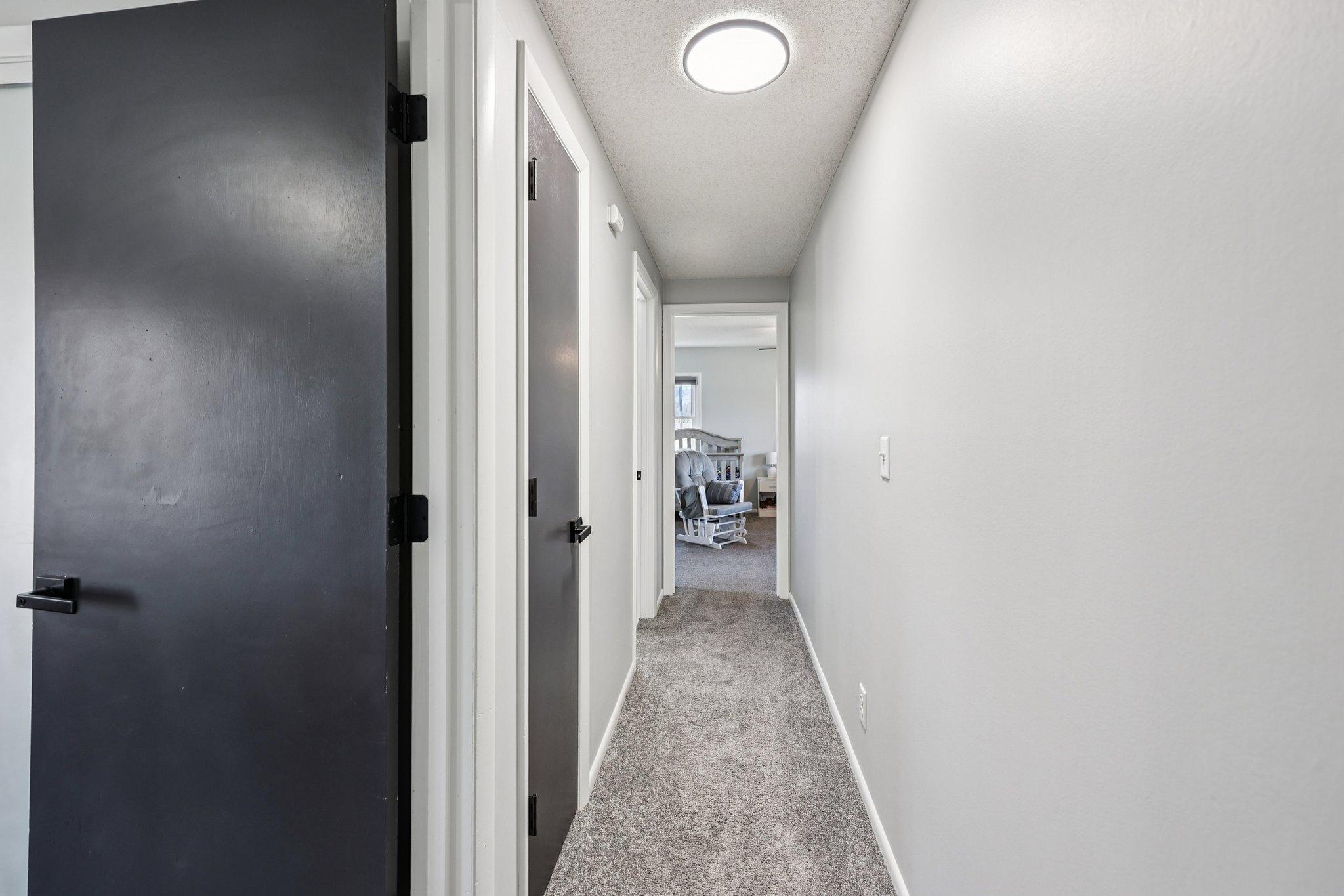 Upstairs hallway with 3 bedrooms