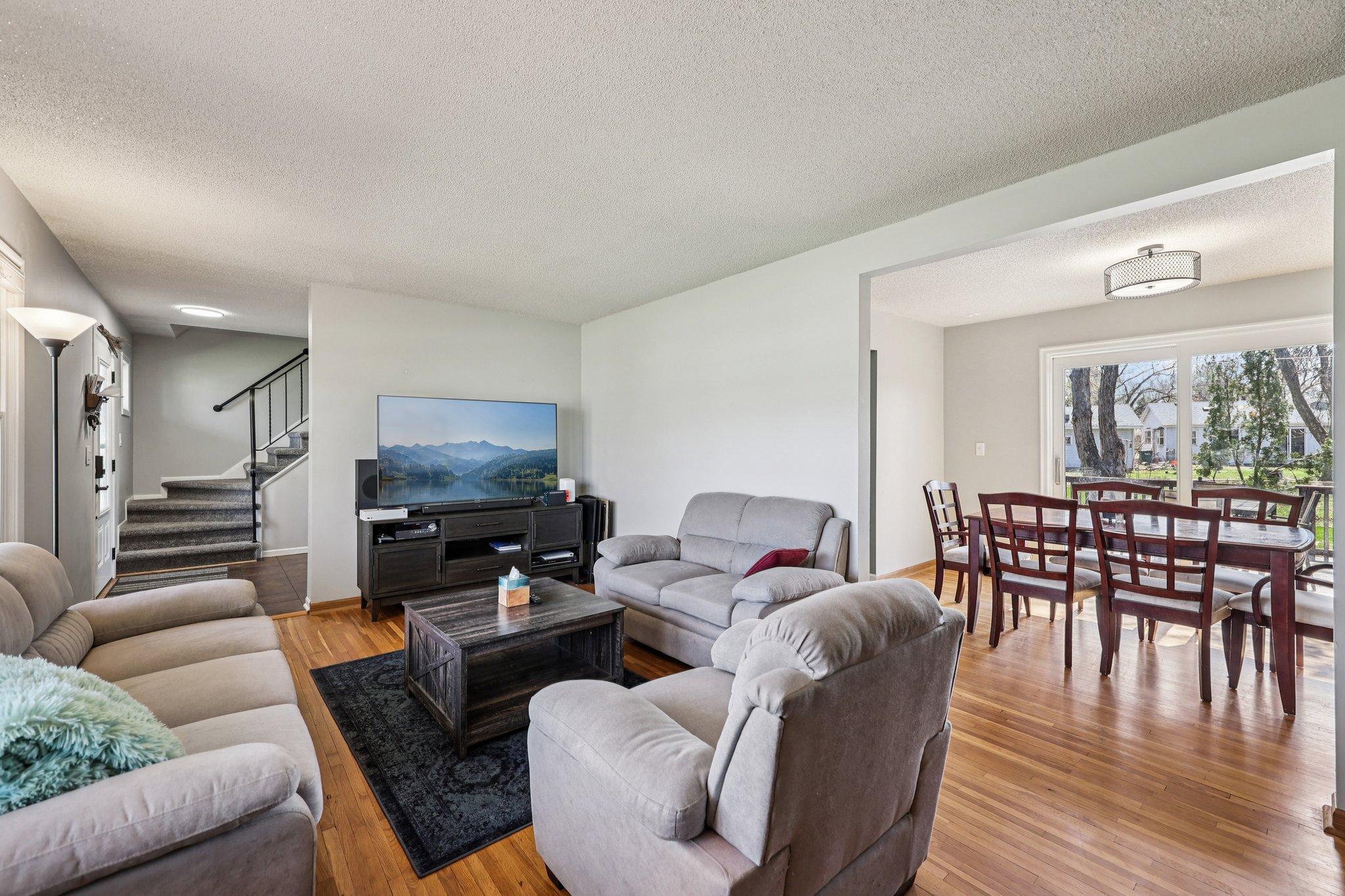 The living room connects to the dining room