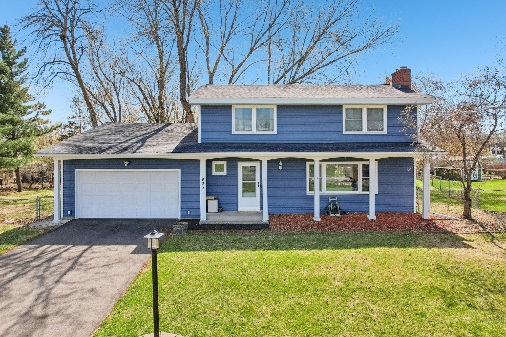 Welcome to 632 109th Ln NE! BRAND NEW roof and siding in 2026