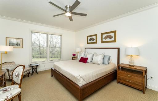 Generous, bright main level primary overlooks woods and valley beyond.jpg