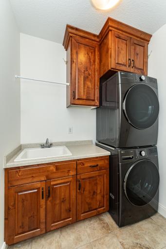 Laundry room with stacked full-sized machines.jpg