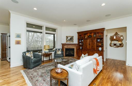 Living area flows out to dining room and screened porch.jpg