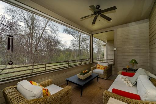 Screen porch overlooks large parklike setting.jpg
