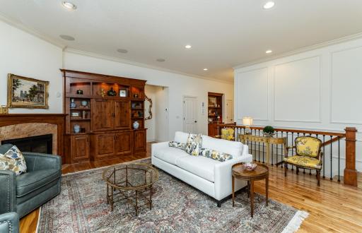 Molded paneling and fireplace create an inviting space.jpg