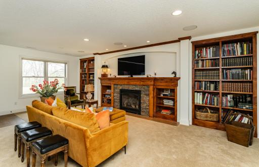 Built-in bookcases amd fireplace provide a cozy retreat.jpg