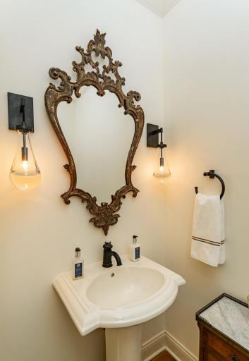 Main level half bath features updated lighting.jpg