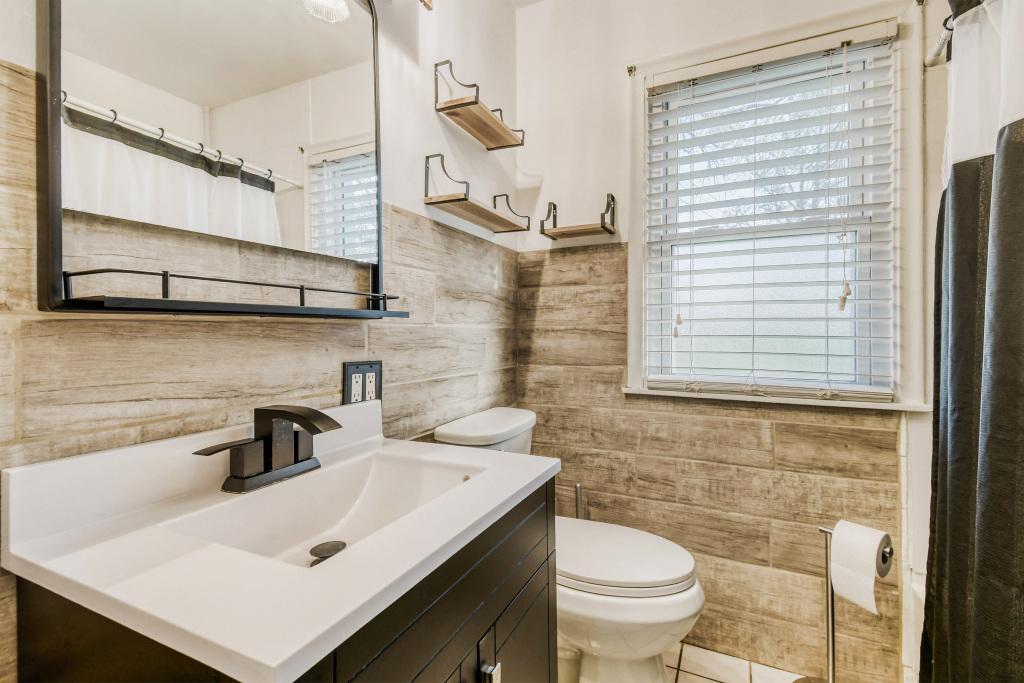 Updated bathroom with new tile and vanity