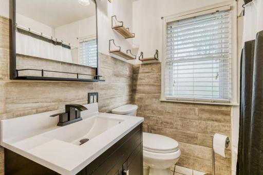 Updated bathroom with new tile and vanity