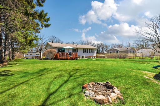 Spacious backyard with firepit