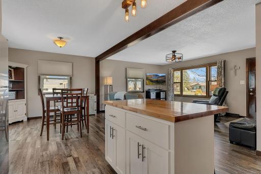 Open concept living bring the kitchen, dining and living room together