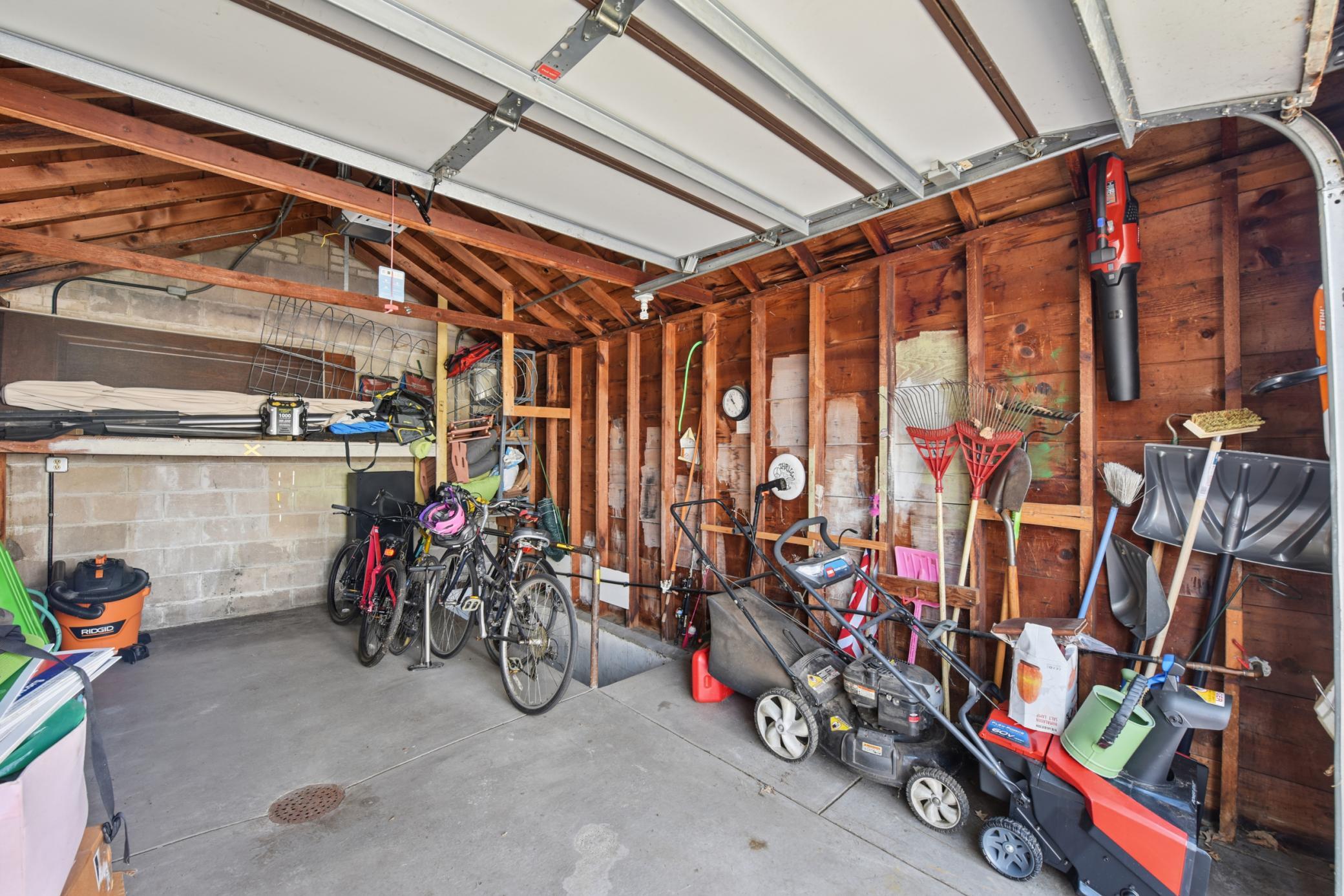 Garage with Stairs to Mud Room
