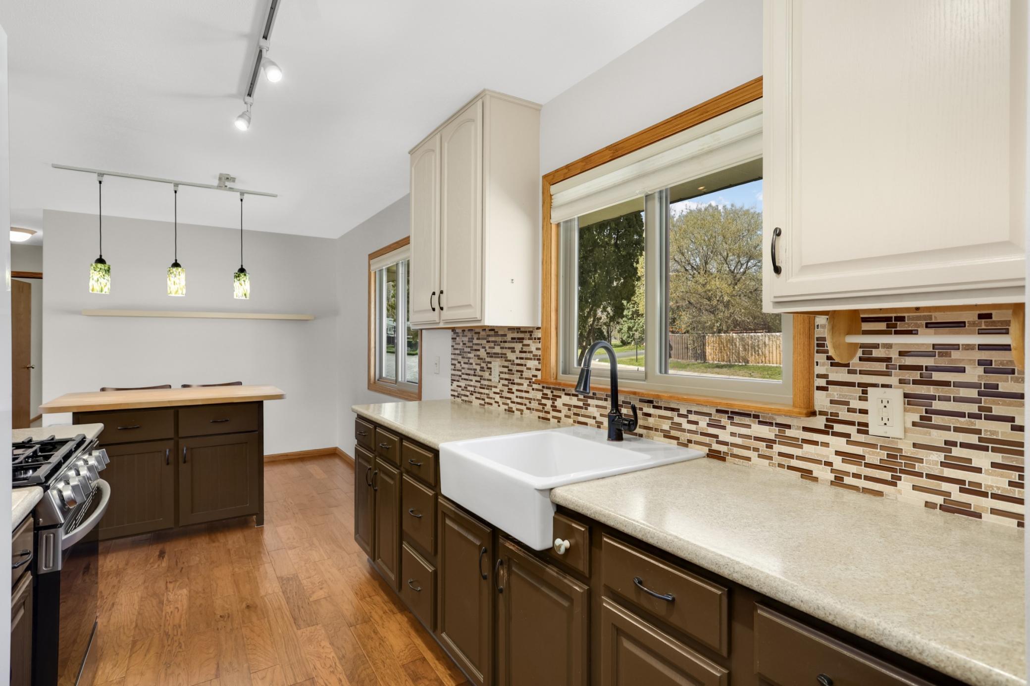 Lovely updated kitchen with built in center island in eat in kitchen.