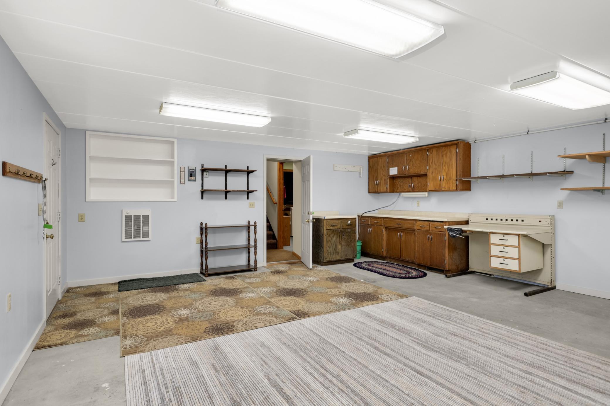 Bonus room 20 x 20 located below the garage-entertainment room, hobby room, workshop. Just needs flooring to be completed. Wired, insulated, sheetrocked and eclectric wall unit.