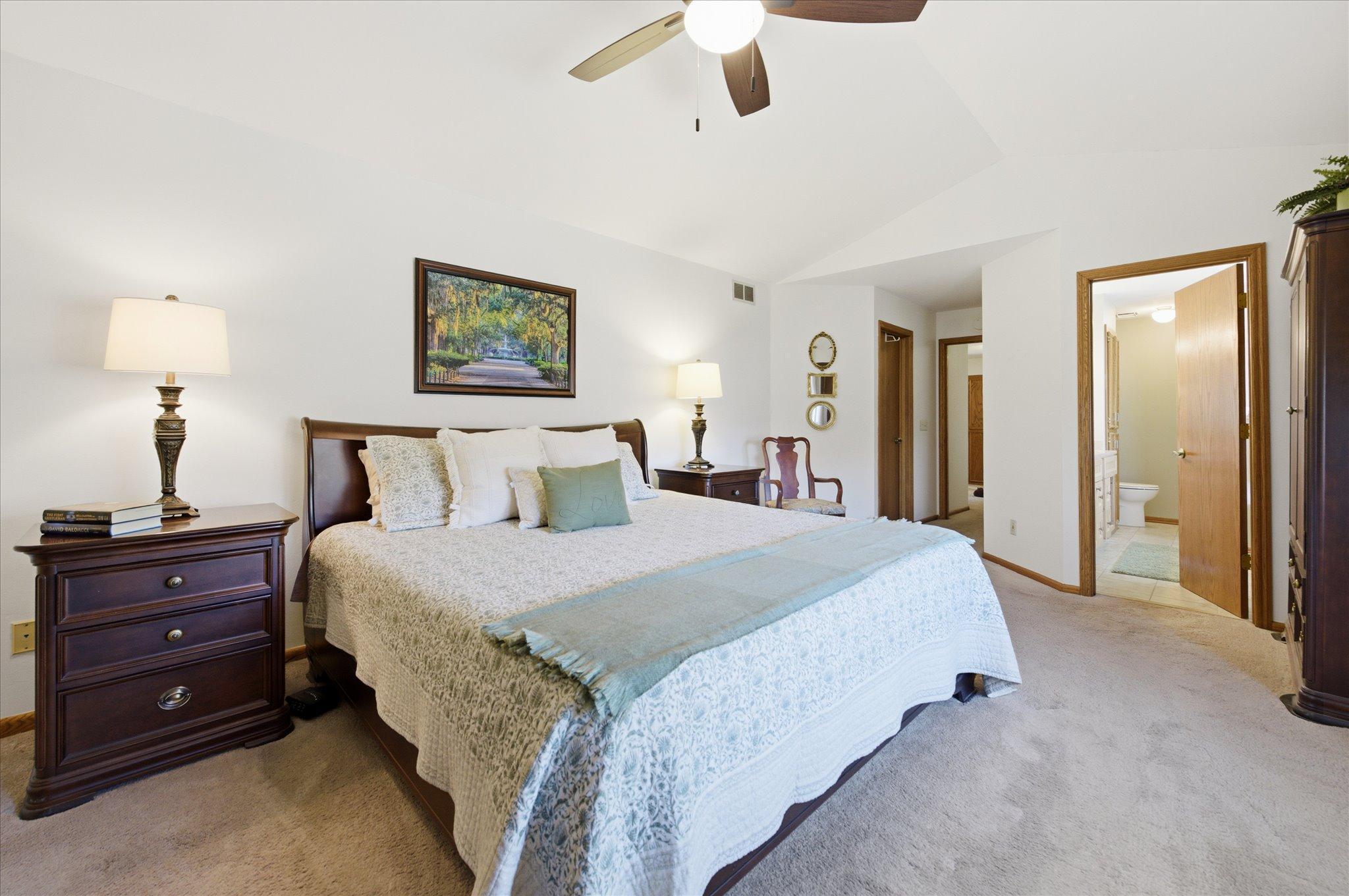 This bedroom accommodates plenty of furniture, has a walk in closet and large primary en-suite bathroom.