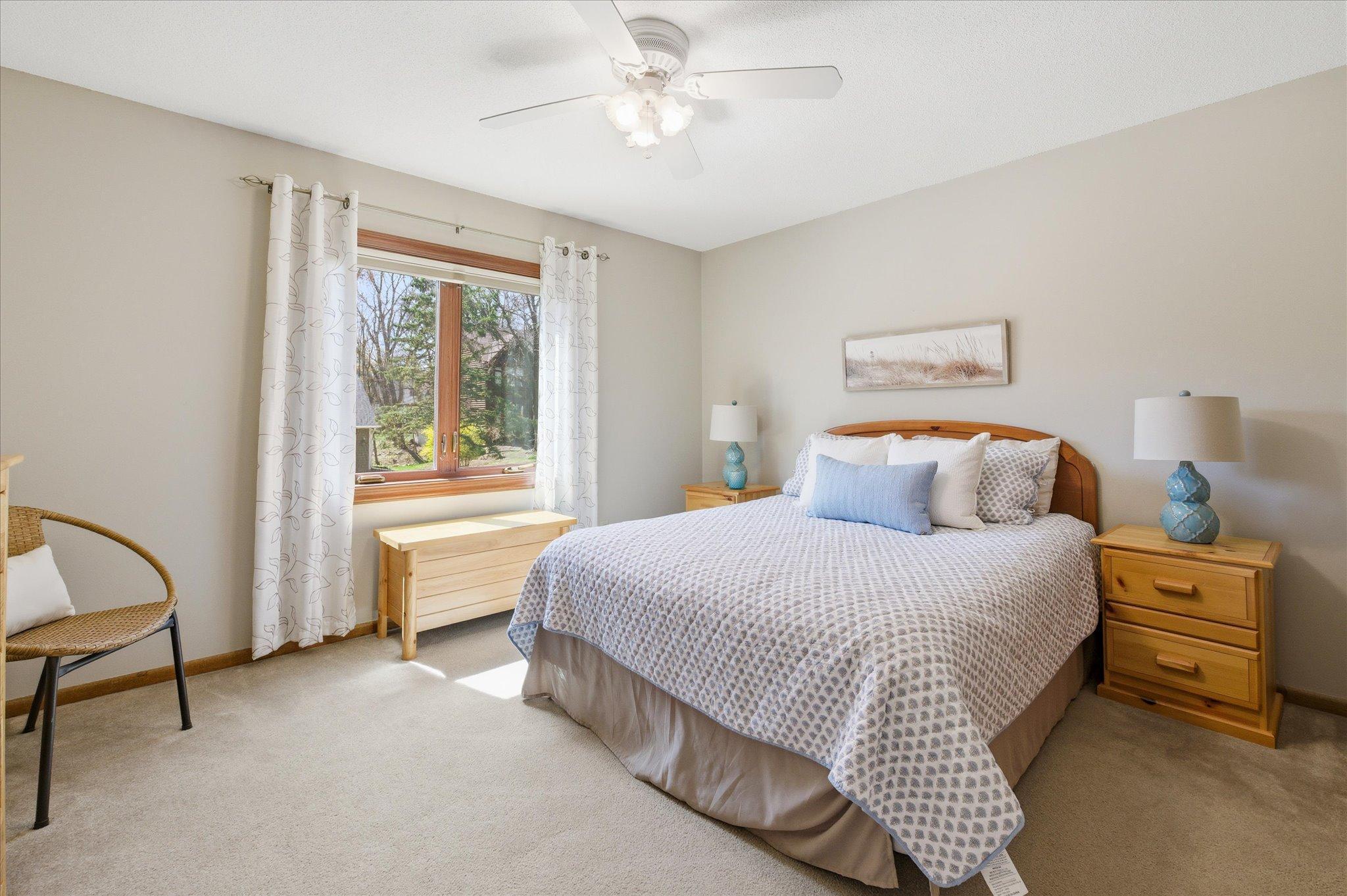 Bedroom #2 on the upper level with a ceiling fan.