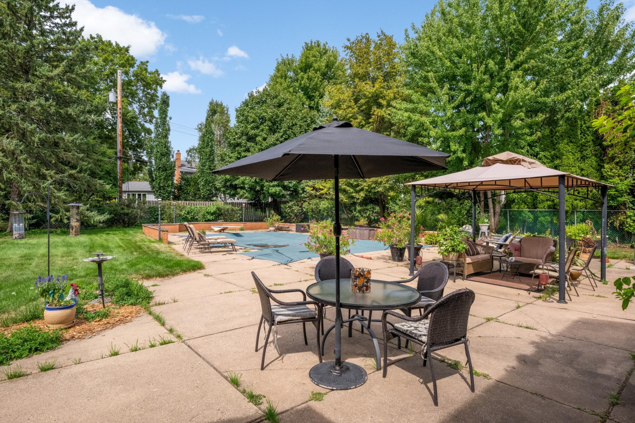 Swimming Pool and Pool Deck in Back Yard
