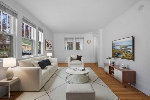 Hardwood floors, natural light, and connected gathering spaces.