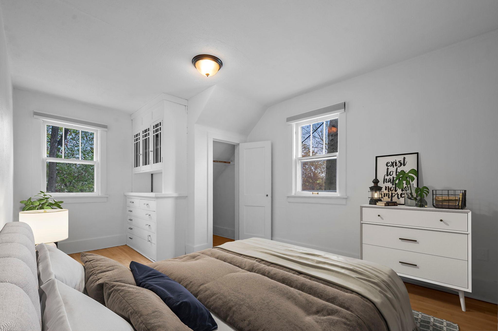 Second upper level bedroom with built-in organization for added character.