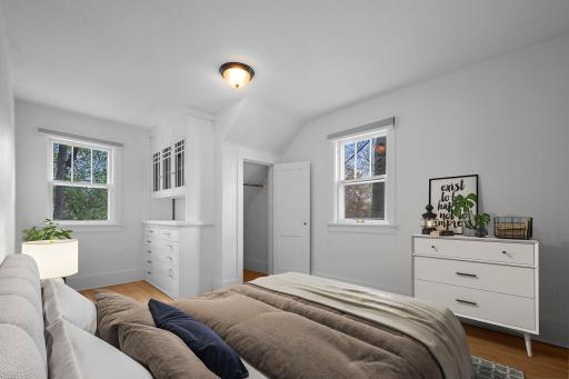 Second upper level bedroom with built-in organization for added character.