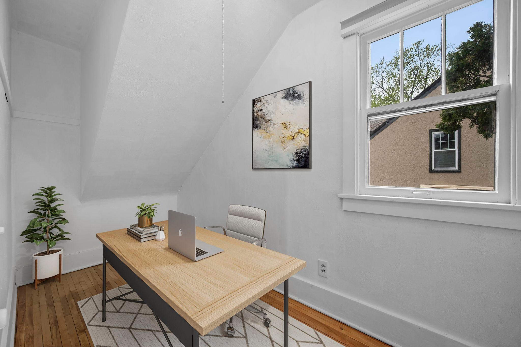 Versatile den space for office, reading nook, or extra storage.