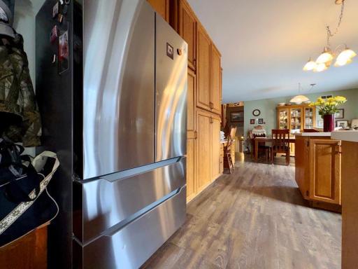 2025 Fridge sitting next to a large built in pantry