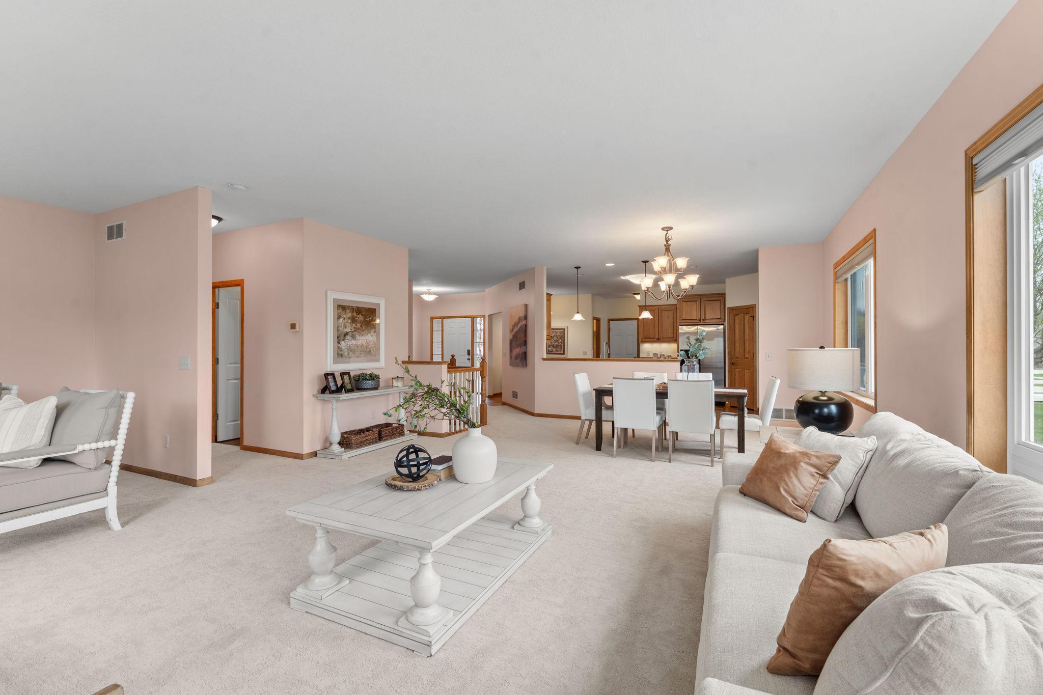 The dining room flows seamlessly into the inviting main-level living room.