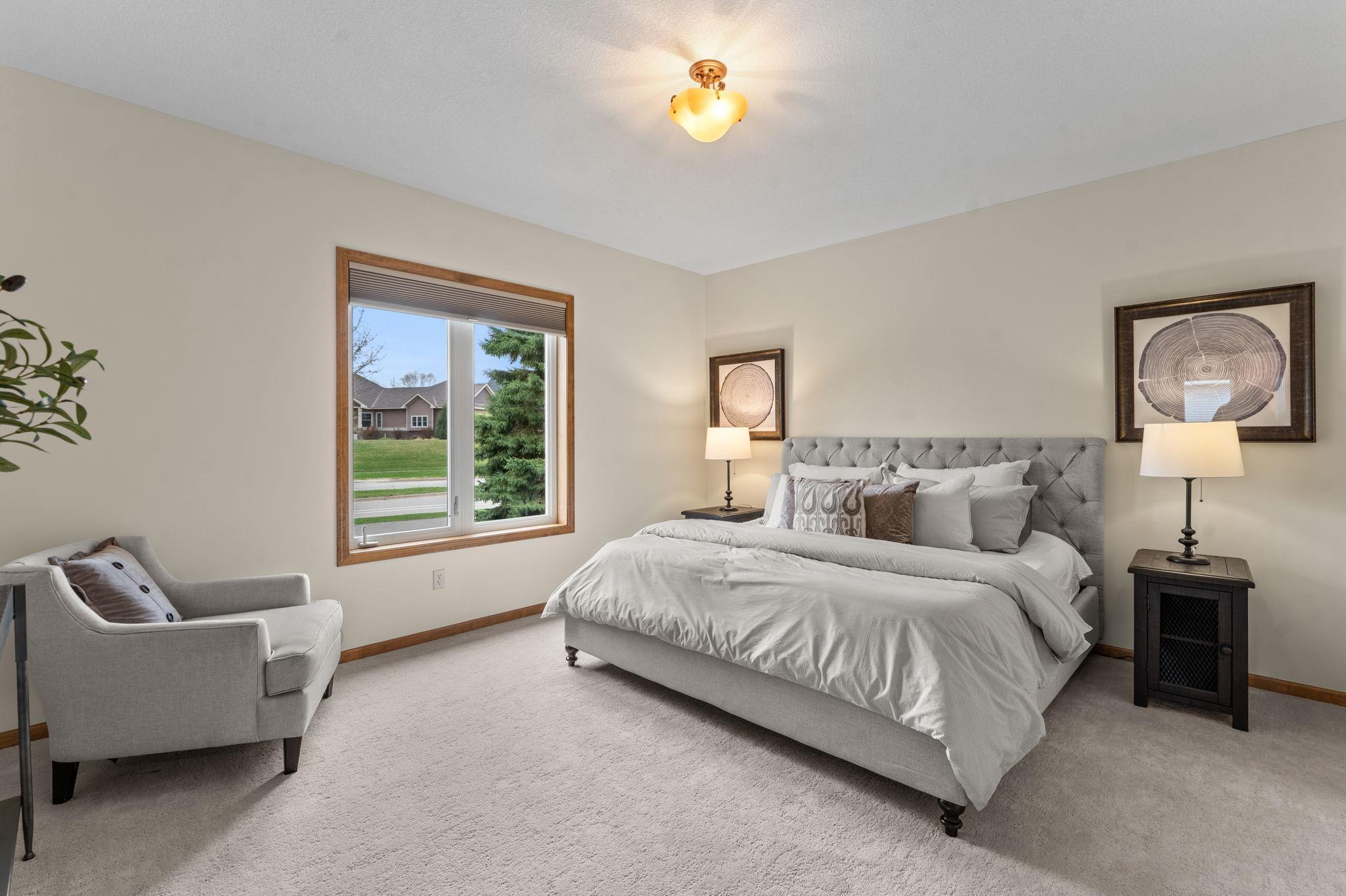 The main level includes two bedrooms, highlighted by a spacious primary suite with an impressive 12x5 walk-in closet.