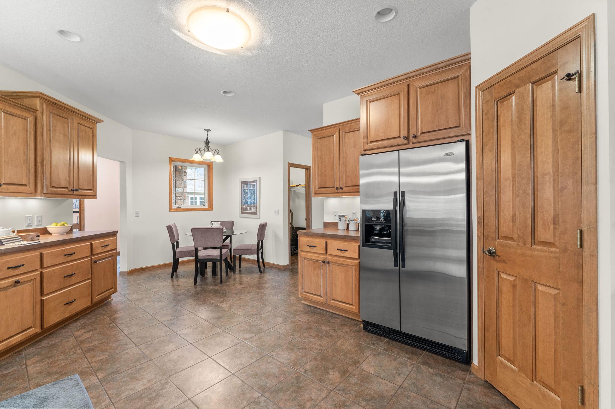 The kitchen also features a cozy, informal eat-in dining area.