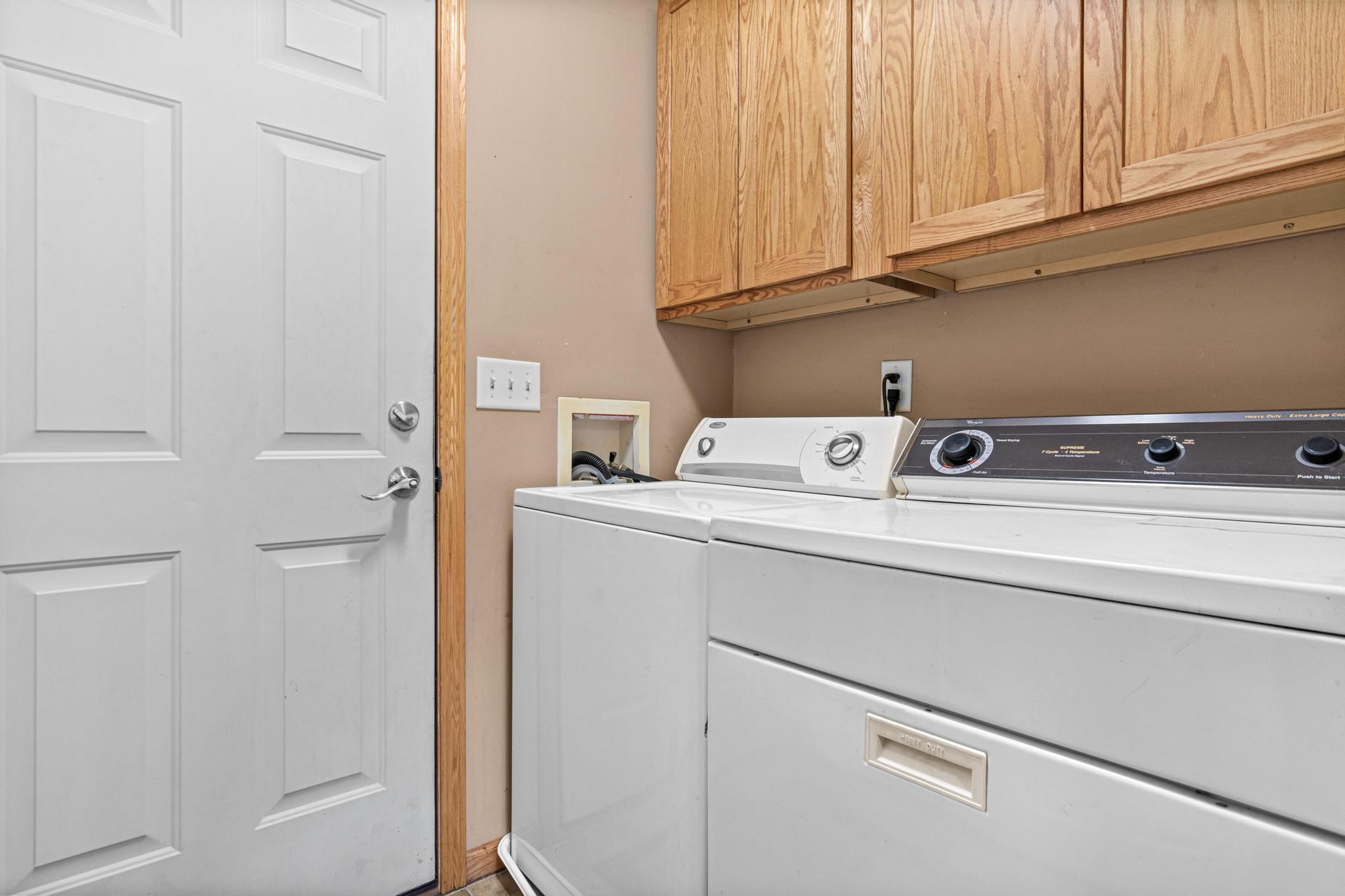 Laundry and door to grage