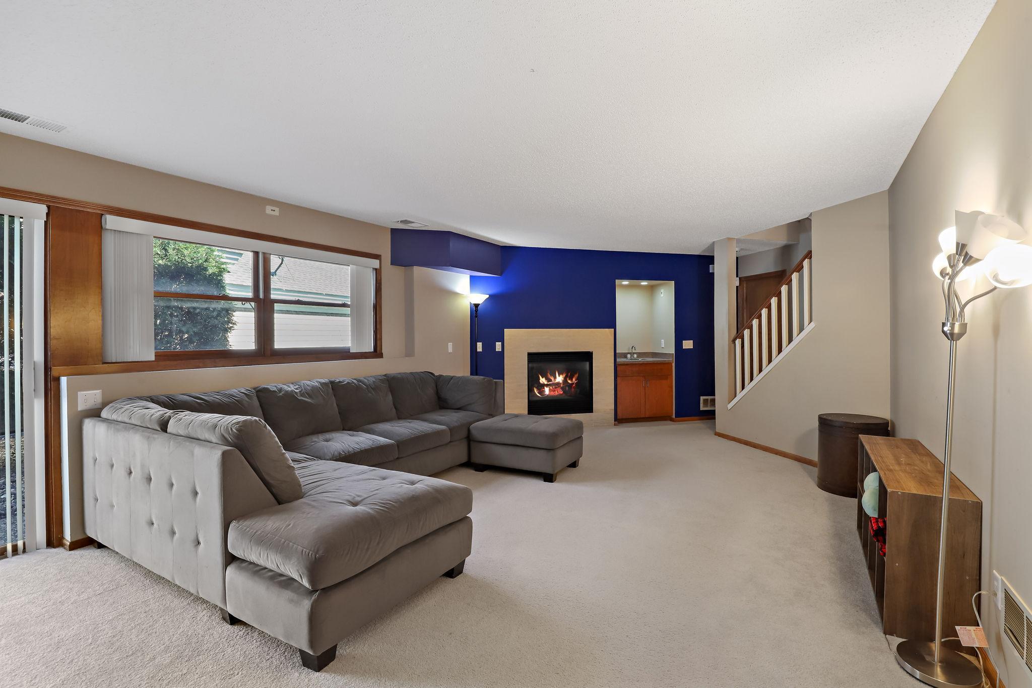 Bright & open family room with fireplace.