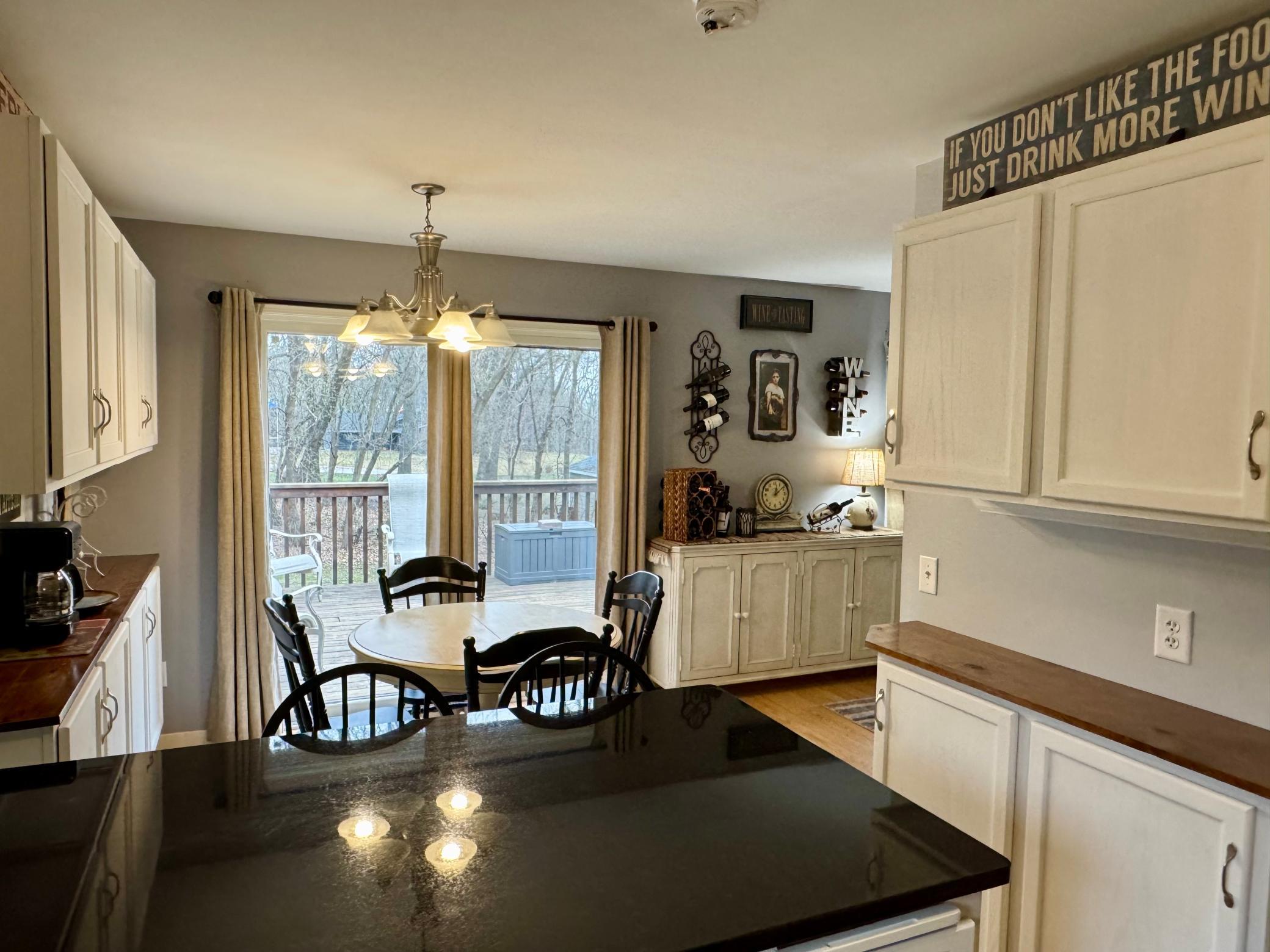 View from kitchen out to backyard and deck