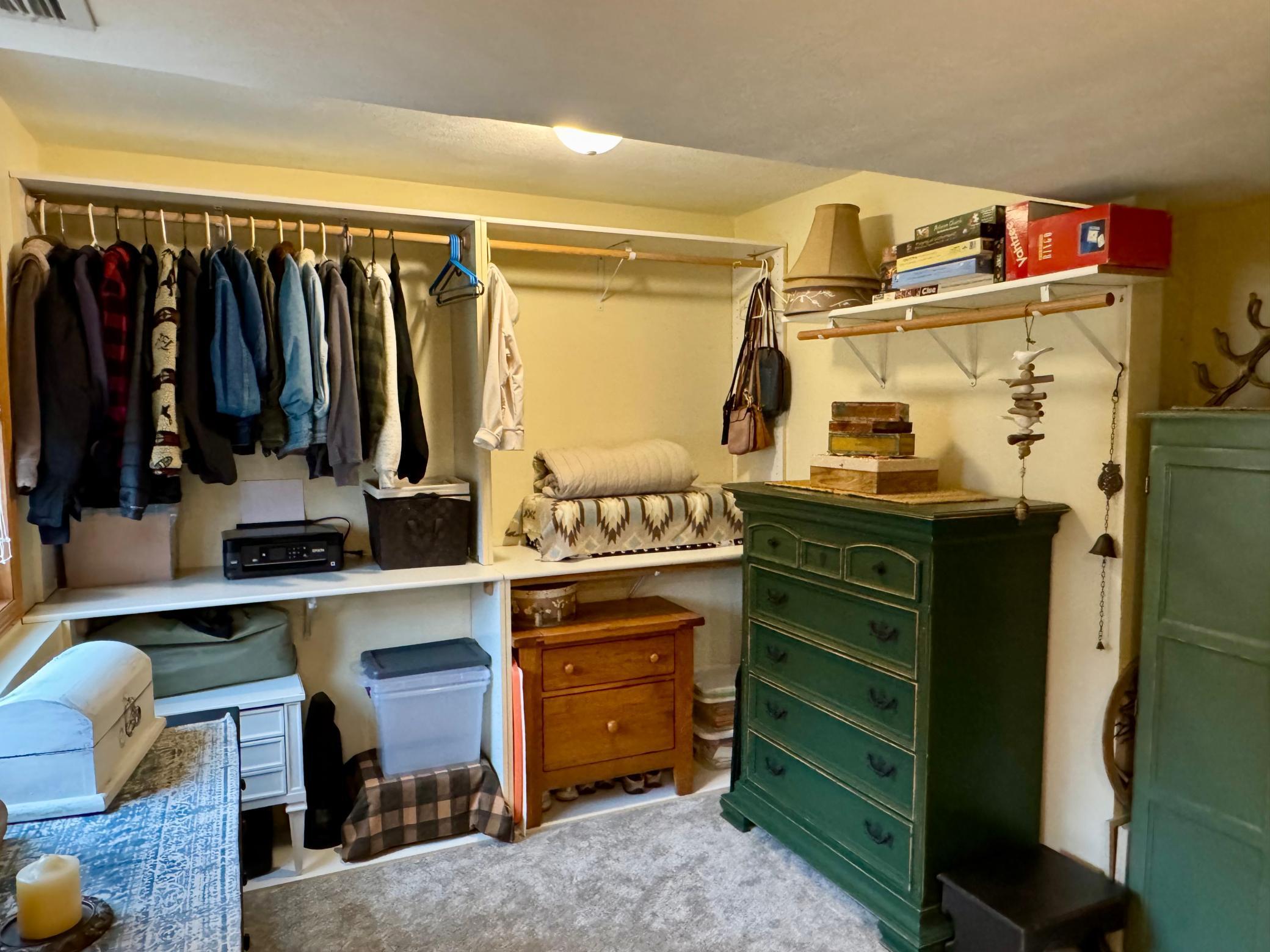 Primary bedroom walk in closet
