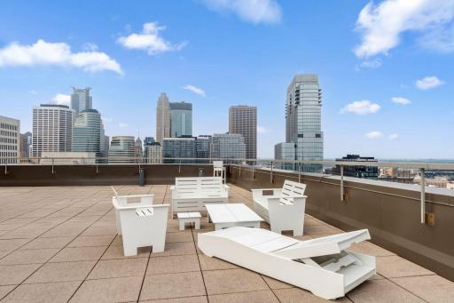The rooftop includes seating for enjoying the city views.