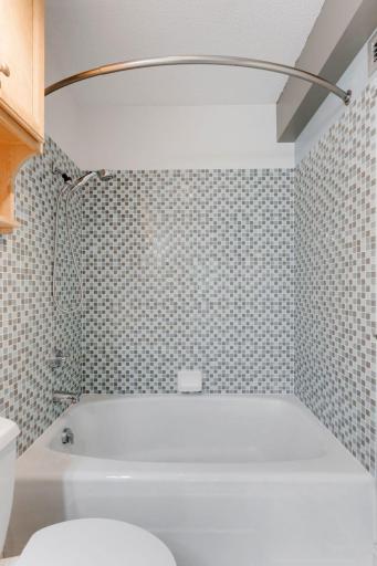 Check out the updated tile in the primary attached bathroom