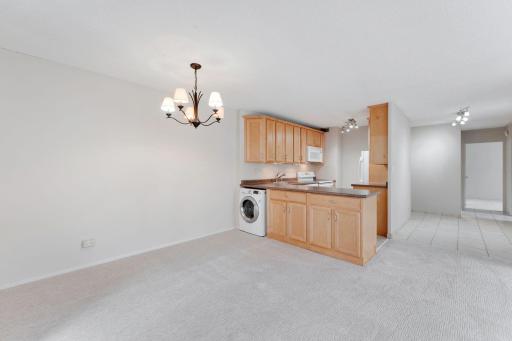 The kitchen features lots of cabinetry and don't miss the in unit washer and dryer.