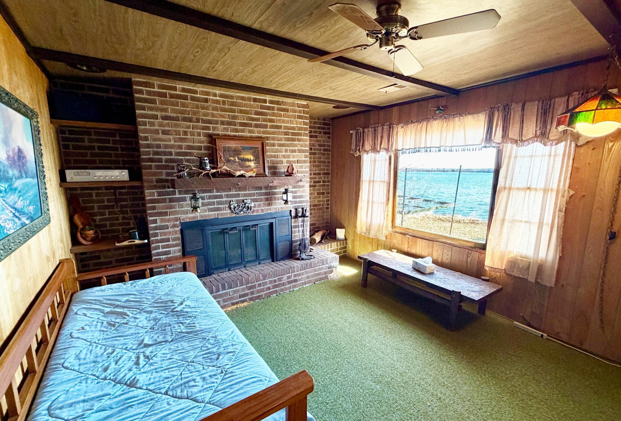 Living room with Lake View and Brick Fireplace.jpg