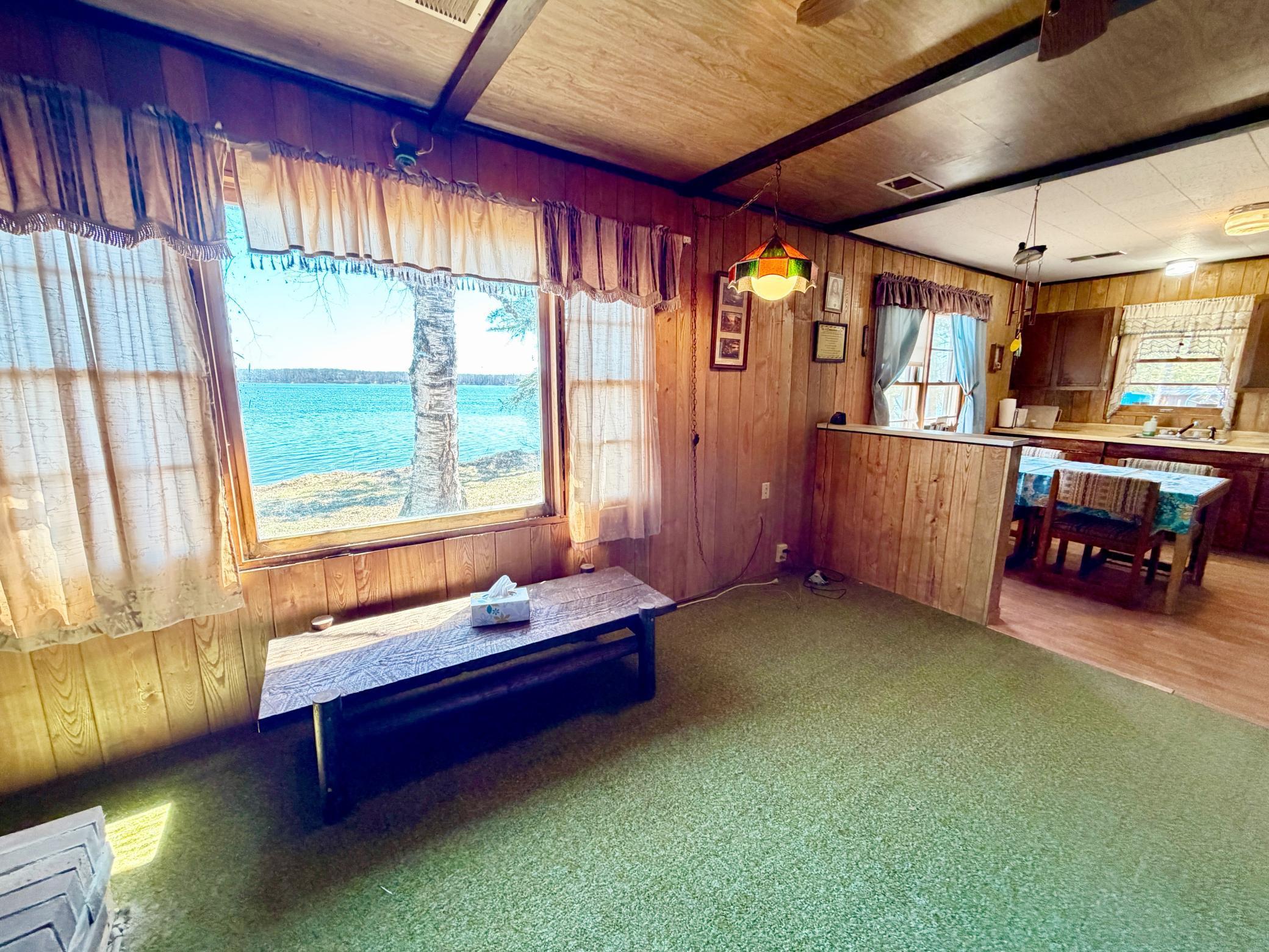 Main view of living to Dining and Kitchen with Lakeviews through out.jpg