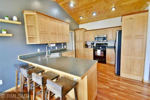 Awesome kitchen with breakfast bar and great cabinet space!