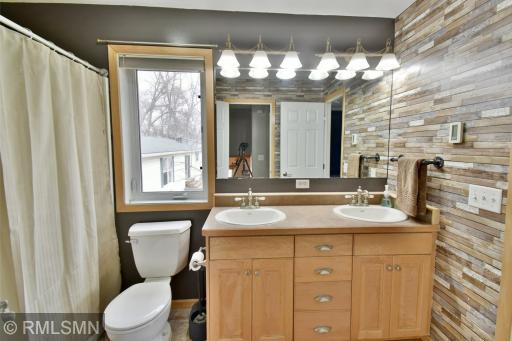 Primary bath - dual sink vanity and heated floor.